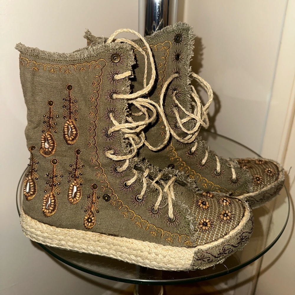 17 miles 
Olive canvas embroidered lace up boots made in Barcelona 
Size 7
